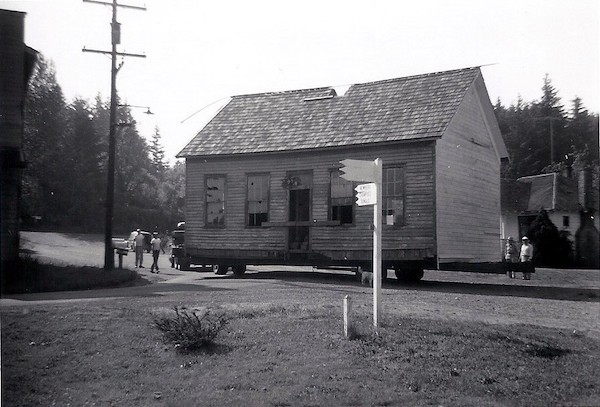 Original Butteville School building, originally located on French St. between Main St. and the river, parked at the corner of Butte and 1st Streets and ready to be moved to the Newell House Museum in 1957