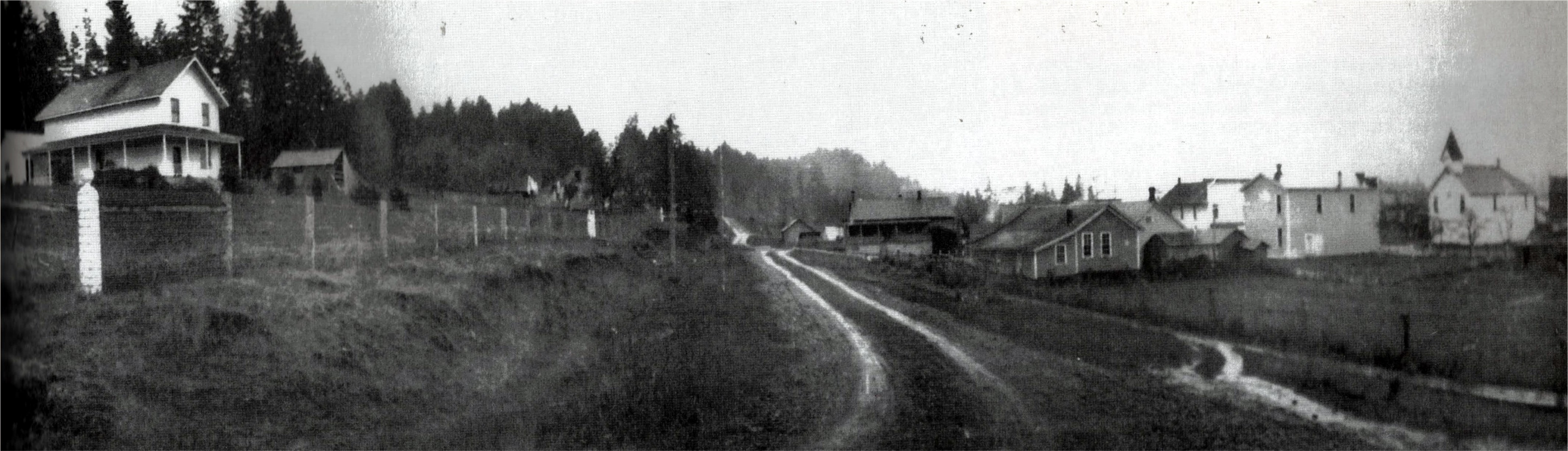 View down 2nd Street (looking southwest in 1914), showing the two story Josie Ryan home on the hill and facing Ladd Hill, that served as a district school in the late 1800s